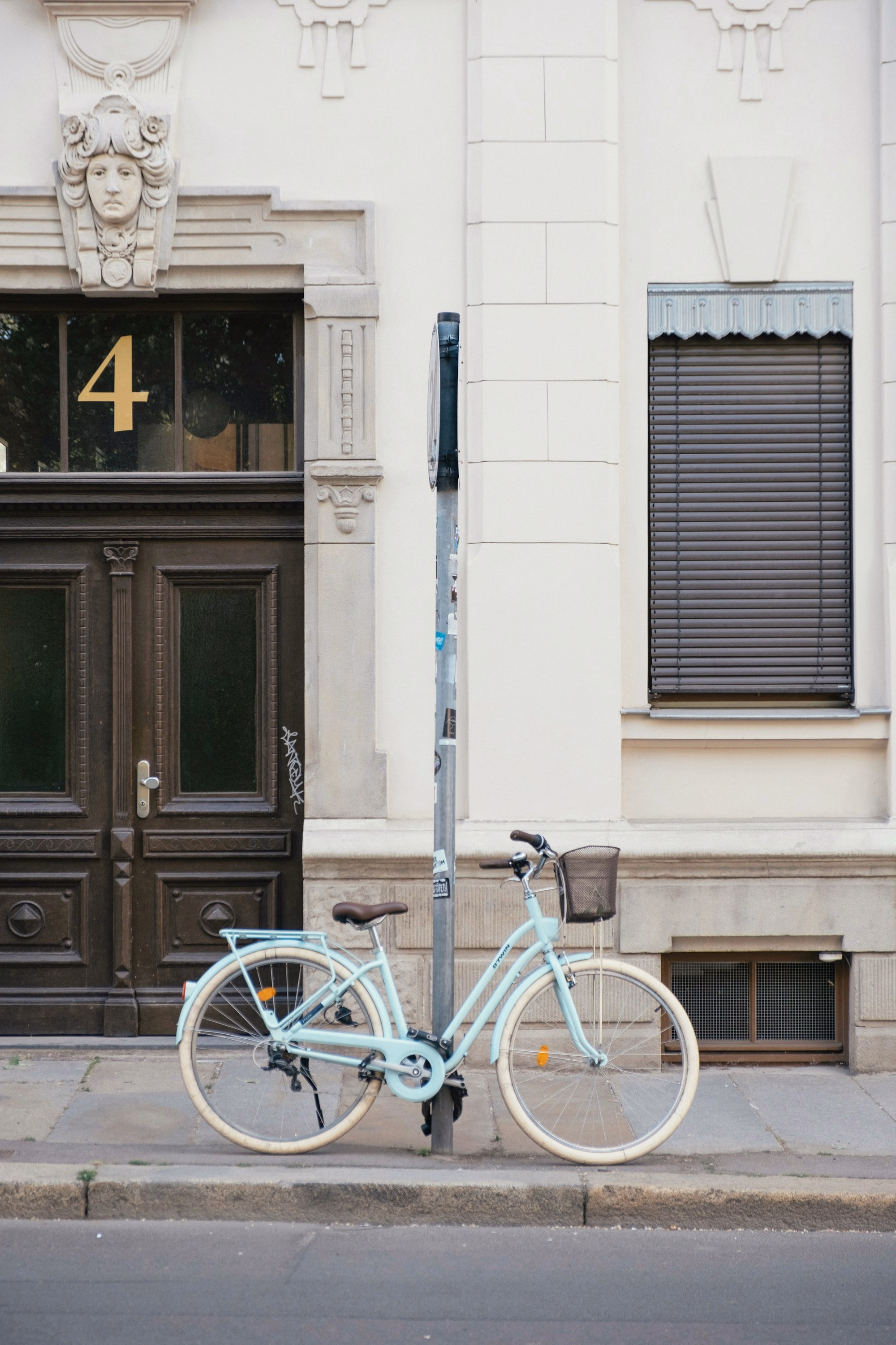 Bike parked by a building entrance